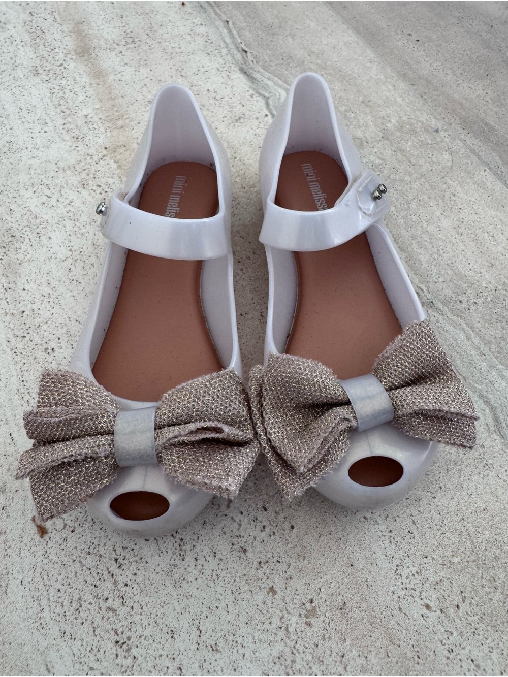 Mini Melissa Ultragirl Bow shoes pearl white with gold bow. Size 12.